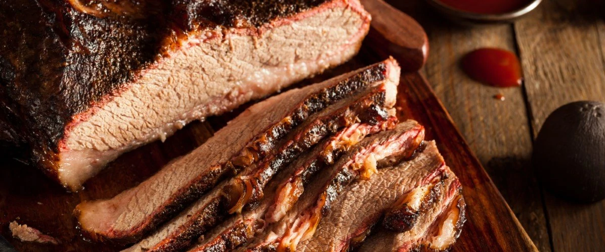 Sliced Barbecue Beef Brisket on wood background