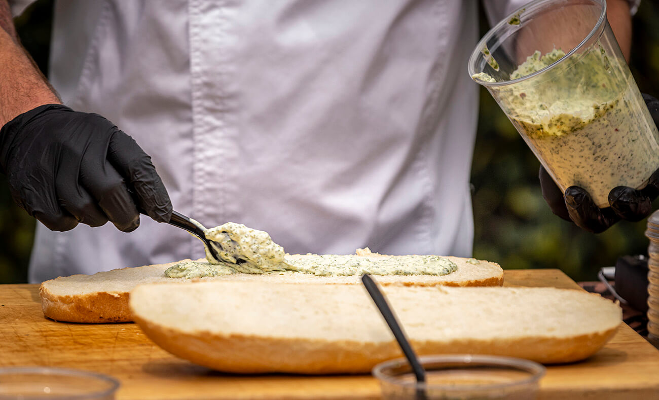 chimichurri aioli spread on a italian loaf sub for a grilled steak sandwich