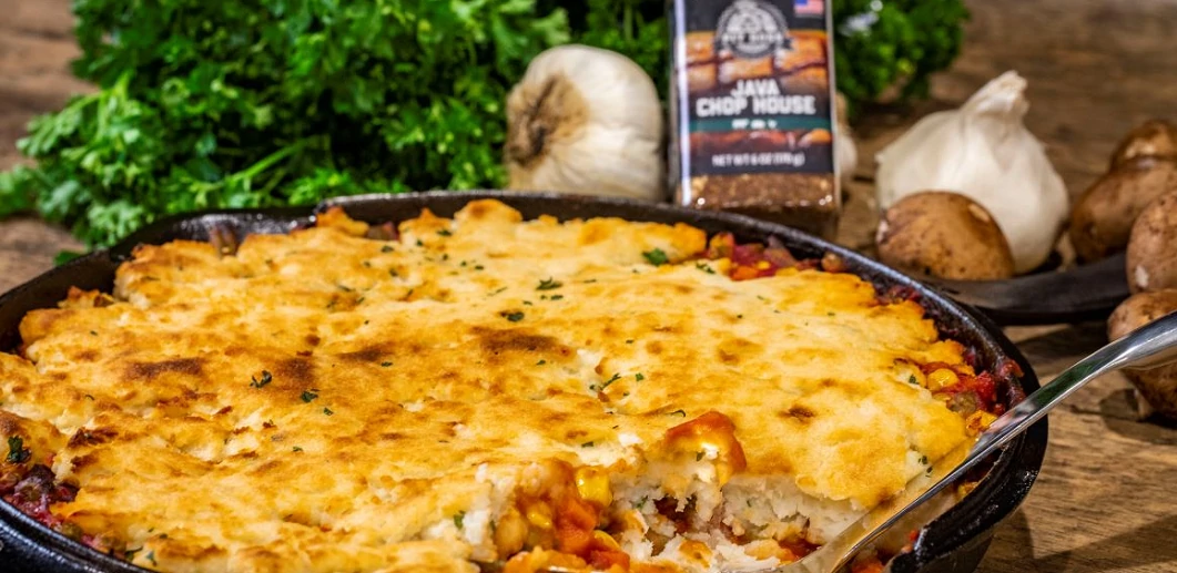 delicious looking Easy Shepherd's pie in cast iron skillet with veggies around it