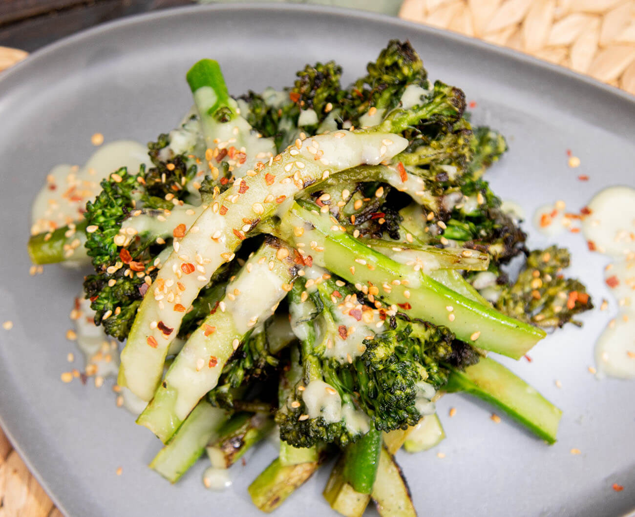 Roasted broccolini with chili flakes and sesame seeds with a ginger mustard sauce