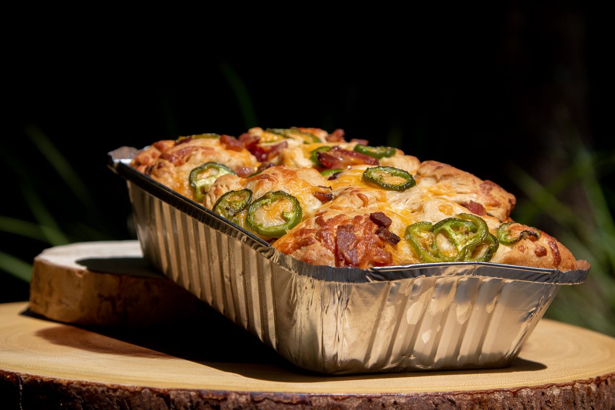 jalapeno cheese in foil pan baked in a pit boss hardwood pellet grill