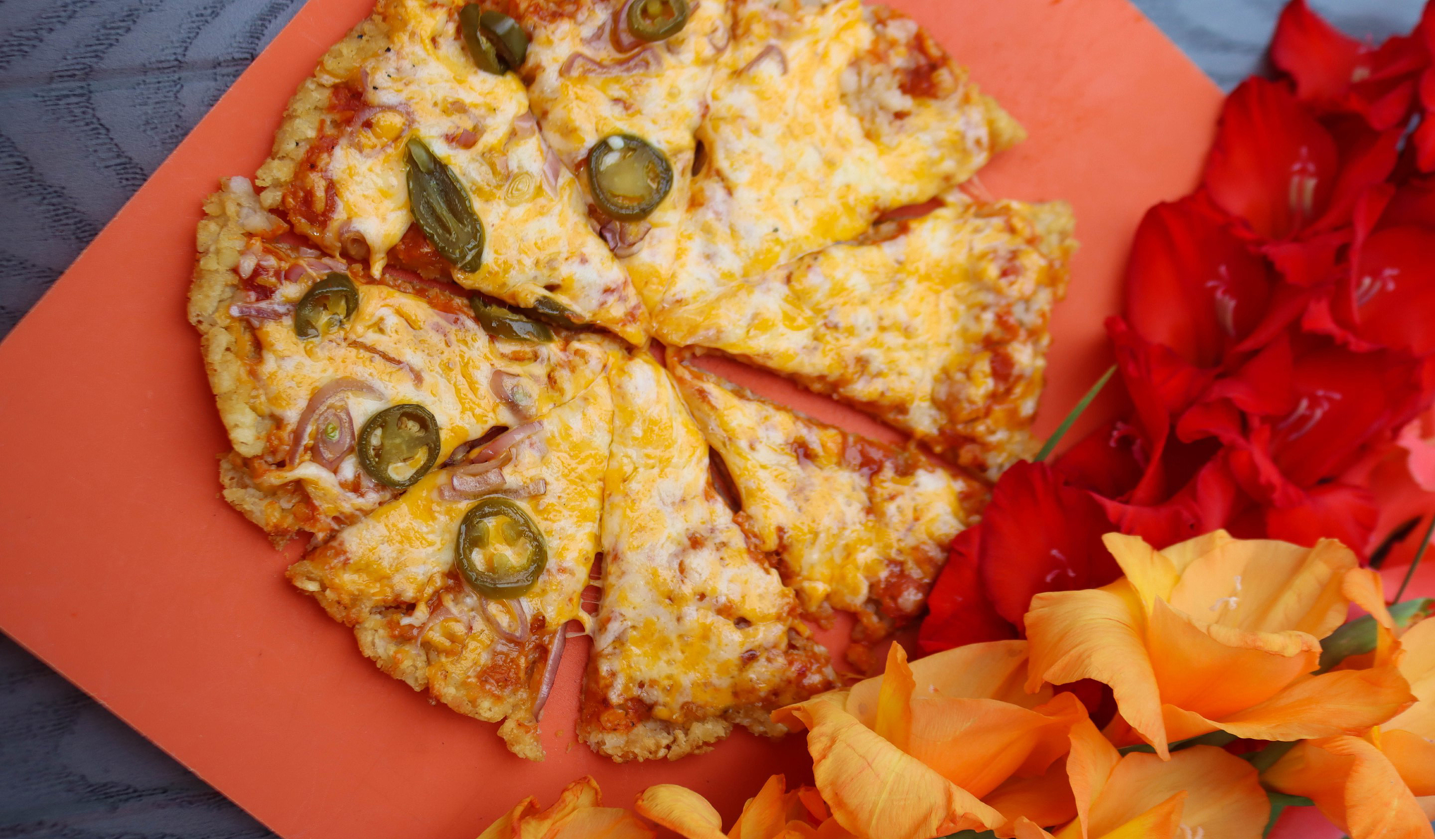 smoked tater tot pizza with jalapenos and cheese