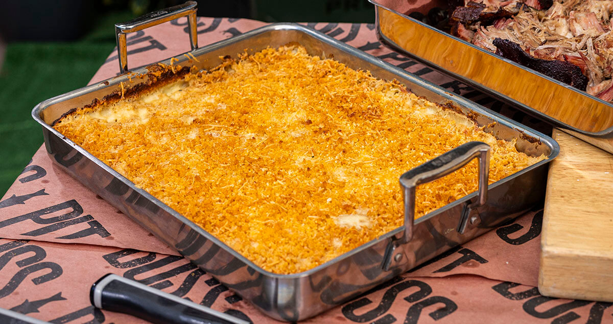 mac and cheese side dish baked on a pit boss wood pellet grill served in a casserole dish