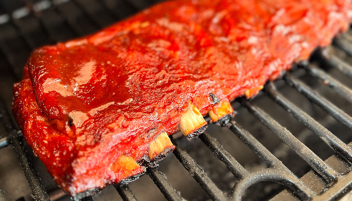 bbq grilled spare ribs with bbq sauce cooked on a pit boss wood pellet grill