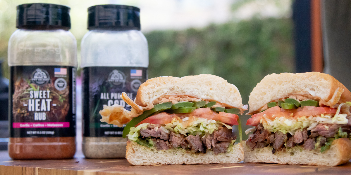 Mexican torta with meat, lettuce, tomato and avocado