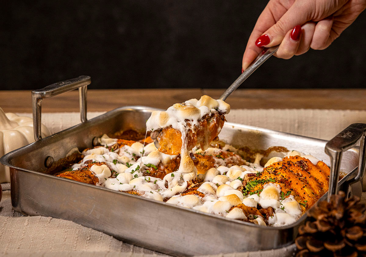 roasted sweet potato casserole au gratin thanksgiving side dish grilled on pit boss wood pellet grill served in metal baking dish