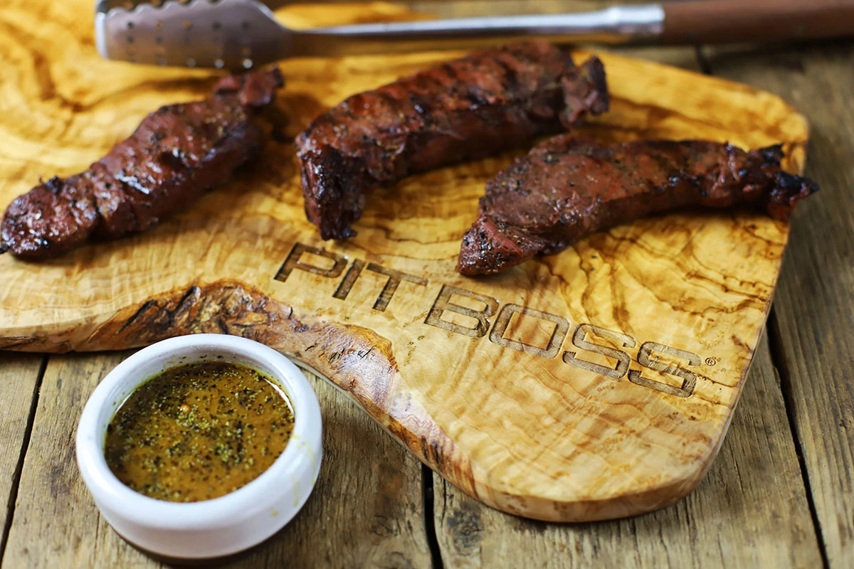 tasty looking Whiskey Grilled Elk steaks on cutting board