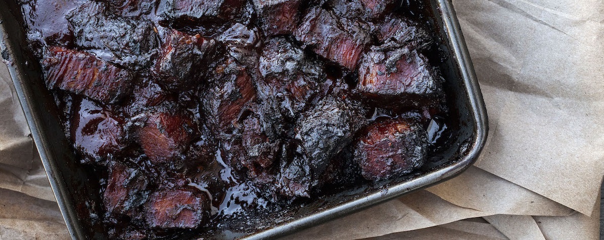 Burnt Ends in pan on parchment paper