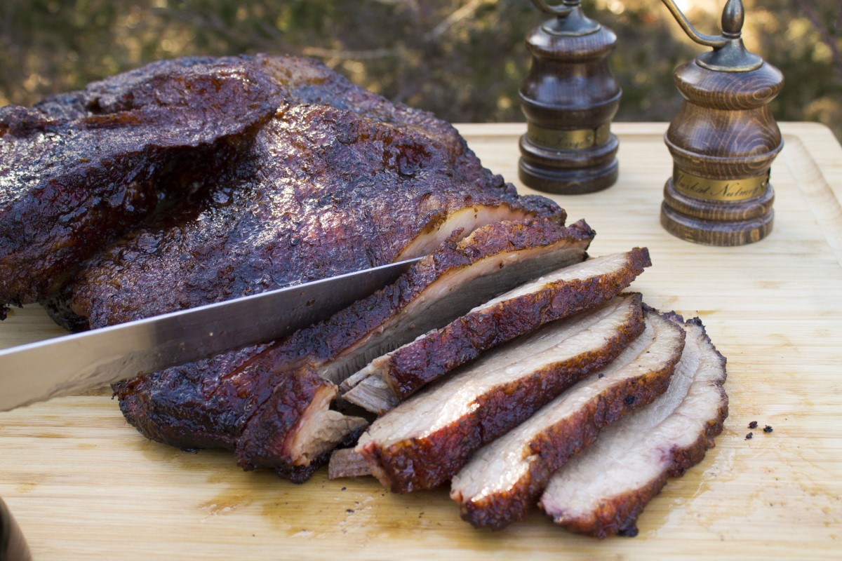 Slicing a classic brisket on a wooden cutting board